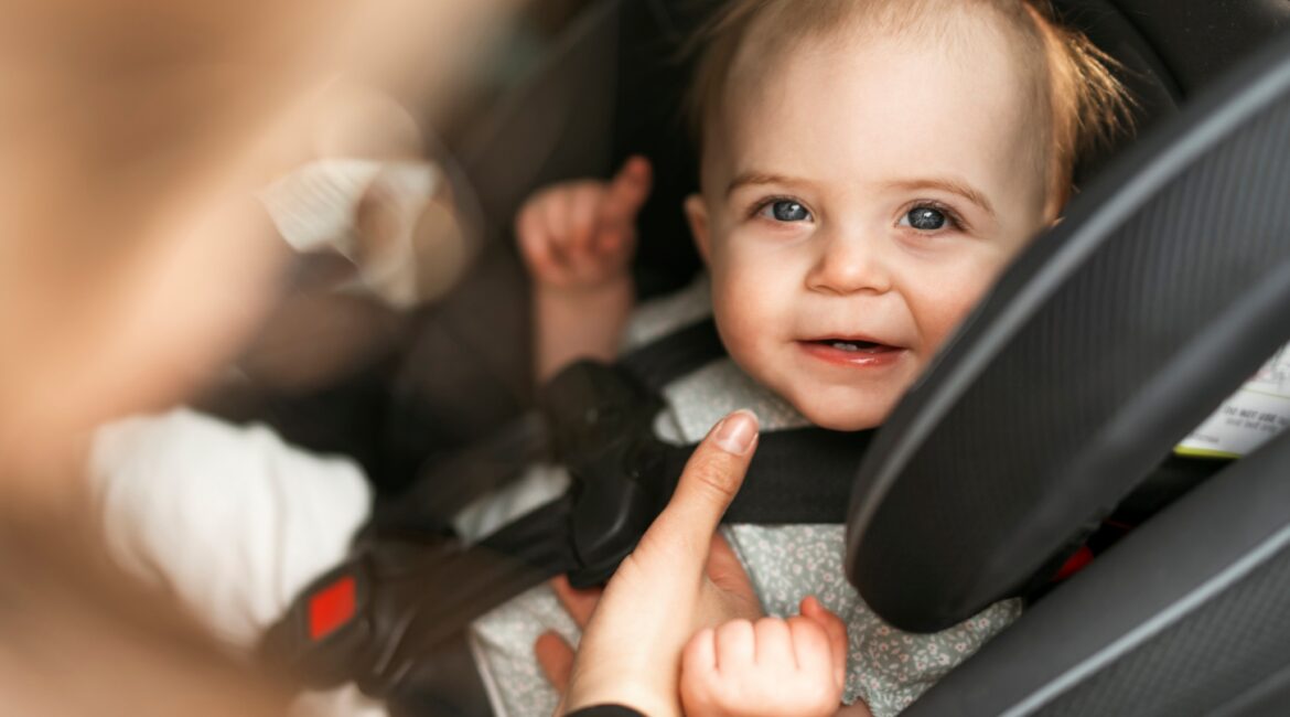 Baby safely secured in a car seat, highlighting the importance of vehicle safety and proper collision repairs